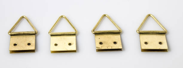 istock Gold hang up paintings in a white background 940446060