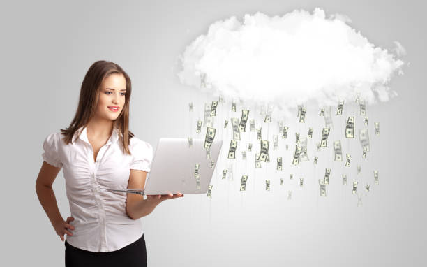istock Woman with cloud and money rain concept 940446408