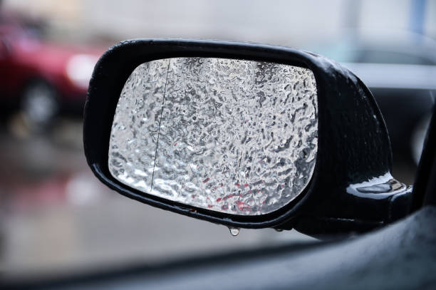 istock Car mirror covered in ice during freezing rain 940446562