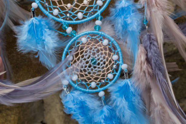 istock Handmade dream catcher with feathers threads and beads rope hanging 940447004