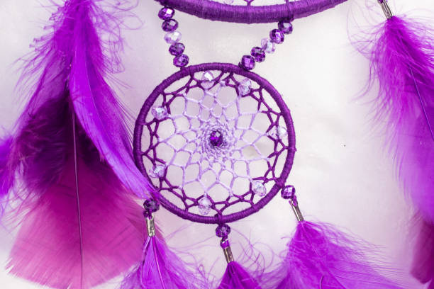 istock Handmade dream catcher with feathers threads and beads rope hanging 940447046