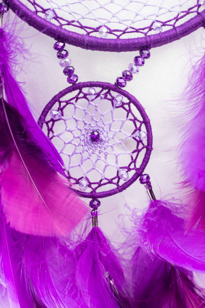 istock Handmade dream catcher with feathers threads and beads rope hanging 940447058
