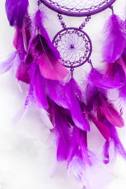 istock Handmade dream catcher with feathers threads and beads rope hanging 940447092