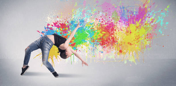 istock Young colorful street dancer with paint splash 940449922