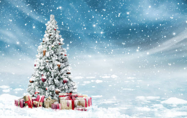 istock Beautiful decorated snowed in christmas tree in a cold winterlandscape 940451048