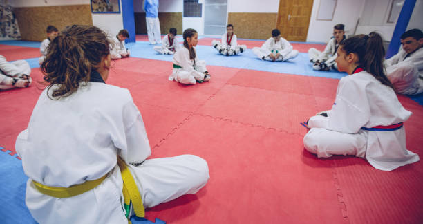 istock Cute kids on Taekwondo training 940451112