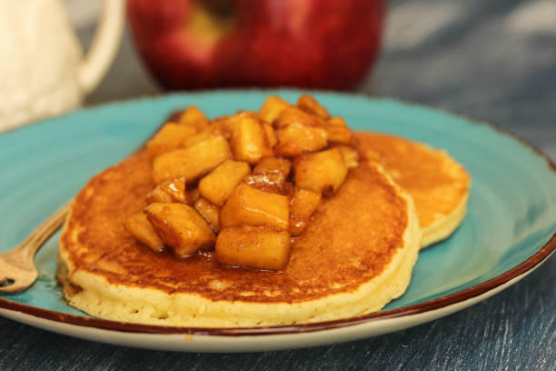 istock Pancakes with caramelized apple topping and syrup 940454578