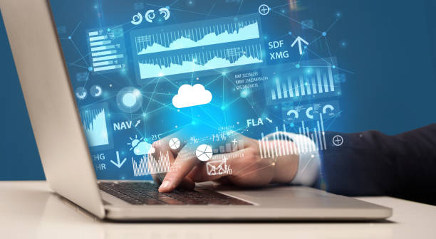 istock Hand typing on laptop graphs and charts and reports concept around 940458324