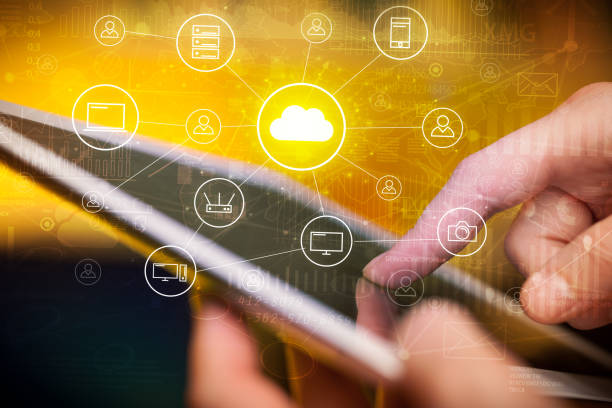 istock Hand working in tablet graphs and charts and reports concept around 940458392