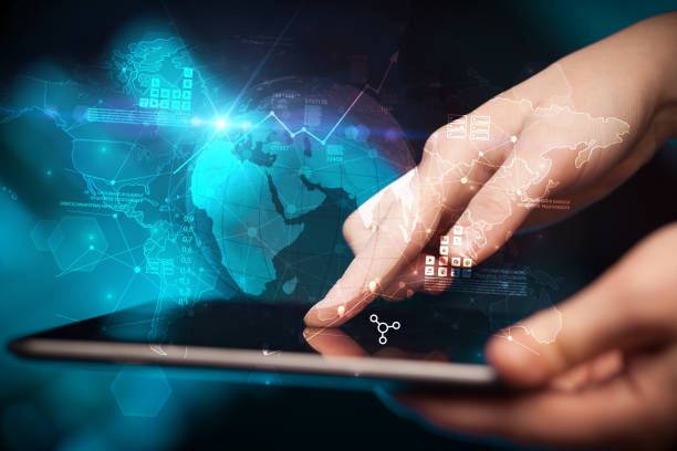 istock Hand touching tablet with global estate report concept 940458514