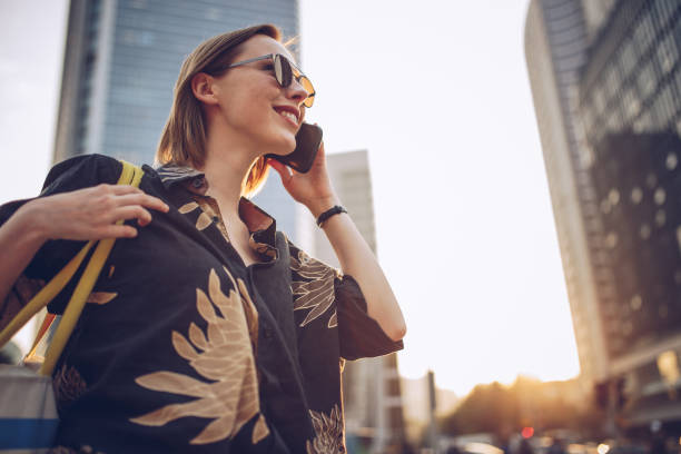 istock Woman talking on the mobile phone outdoors 940463090
