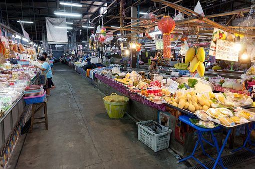 CHIANG MAI, THAILAND - FEBRUARY 23, 2018: An usual market in Chiang Mai, Thailand. There are many fruits on that stand.