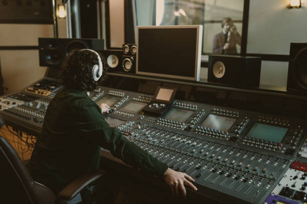 istock sound producer working at studio while recording song 940465890