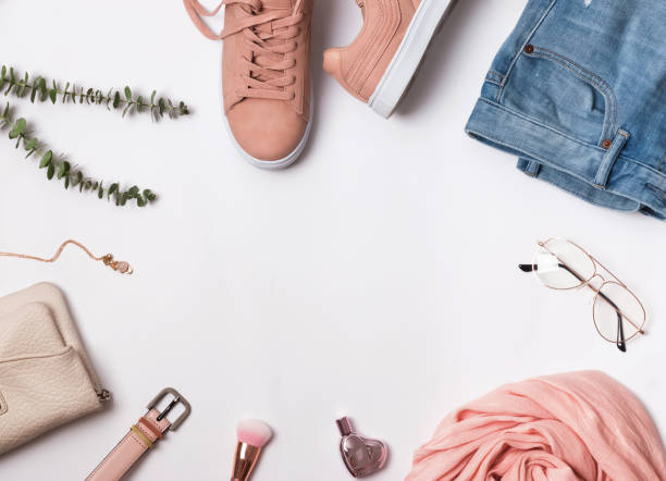 istock Flat lay with pink sneakers, scarf and other accessories. 940469564