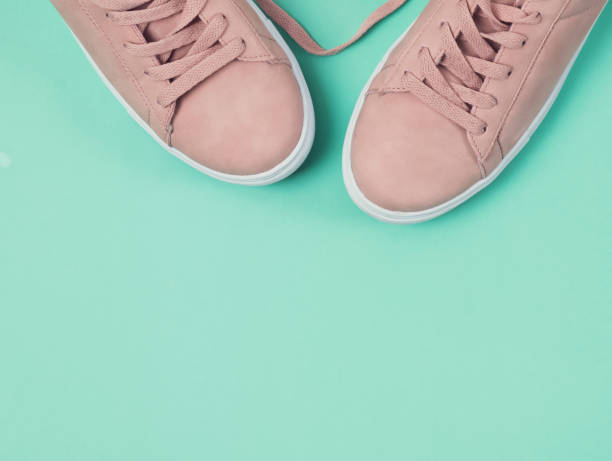 istock Pink sneakers on the mint color background 940469568