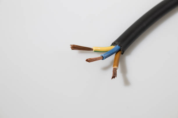 istock Electric wires in a white background 940471854
