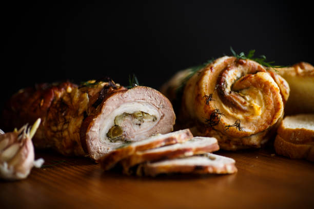istock Roll of meat with various spices and herbs 940476288