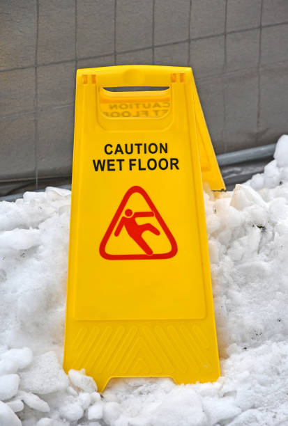 istock Caution wet floor sign in the snow outdoor 940476410