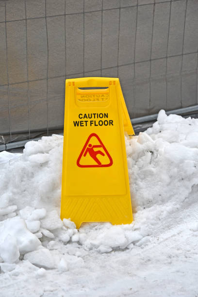 istock Caution wet floor sign outdoor in winter 940476412