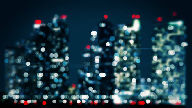 istock bicolor blurred lights of skyscrapers in night city 940478844