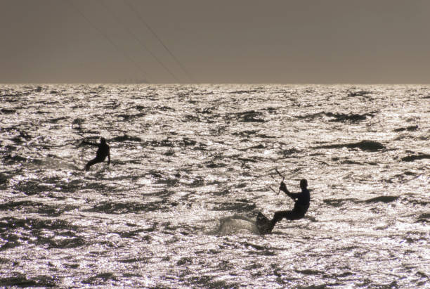 istock two kite surfers on sea 940479300
