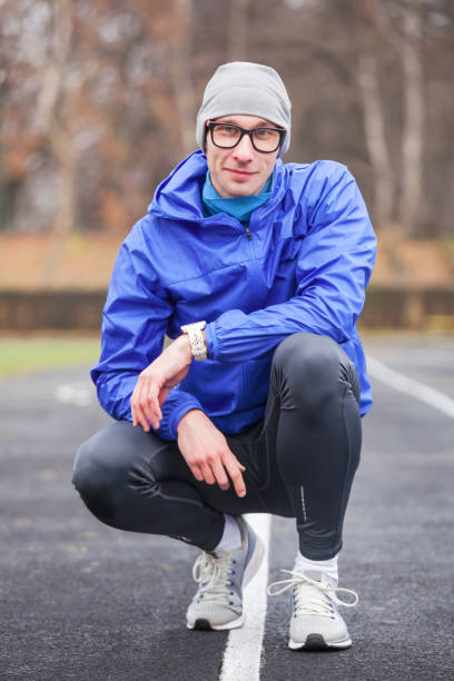 istock Shot of a young handsome professional runner looking at camera. 940491518