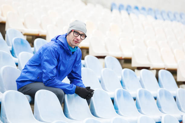 istock Shot of professional athlete looking at camera sitting. 940491788