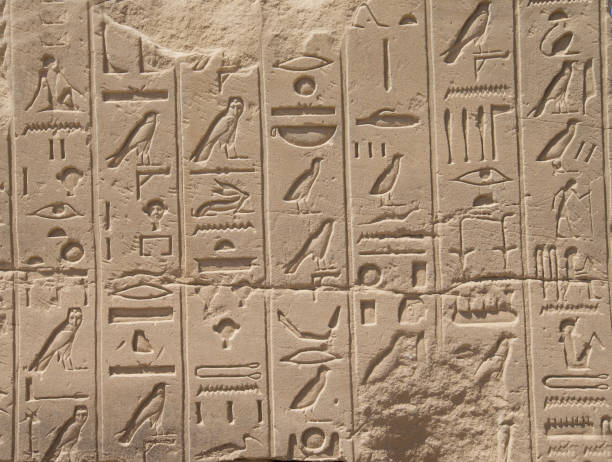 istock old egypt hieroglyphs carved on the stone 940497492