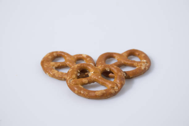 istock Salty snack brezel in a white background composition 940505434
