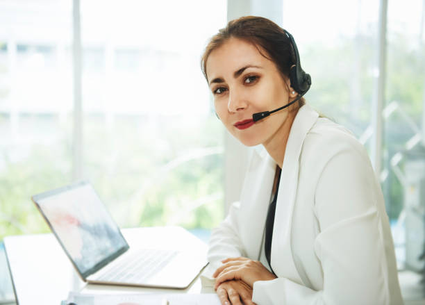 istock women happy smiling customer support operator with headset. communication concept. 940508772