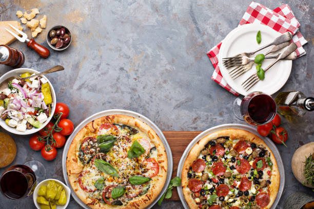 istock Margherita and pepperoni pizza with basil 940508822