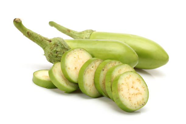 istock Portion cut fresh green long eggplant on white background 940508882