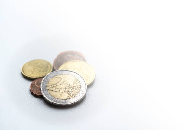 istock Two euro.  Several euro coins on light blurred background. 940512952