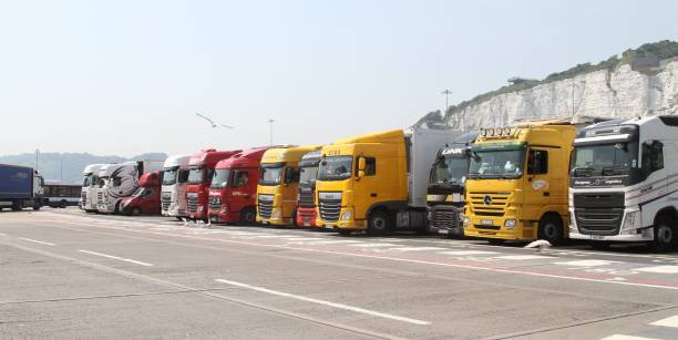 Freight vehicles waiting to get on ferry at Dover port england UK stock photo