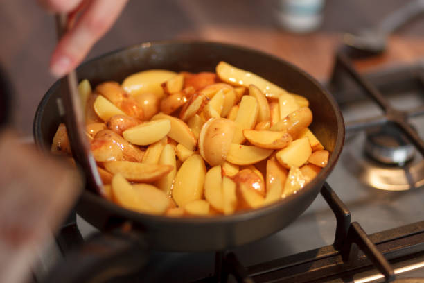 istock Cook frying new potatoes 940519646