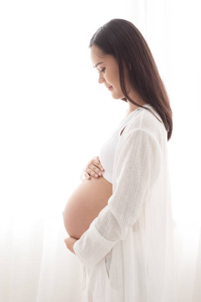 istock pregnant woman touch her belly 940525142