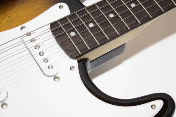 Electric guitar in a white background