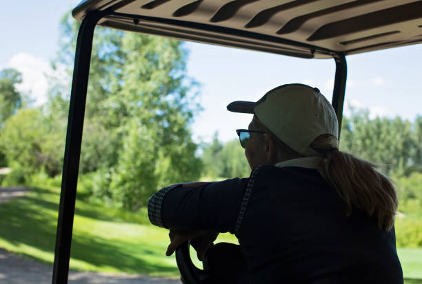 istock Female Golfer Waits Patiently 940528132