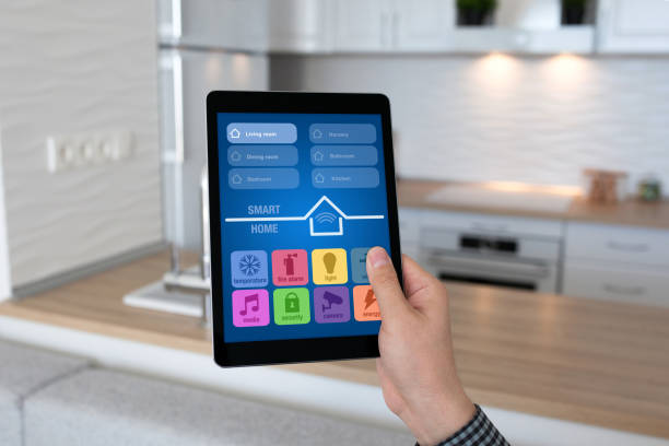 istock man hand holding tablet app smart home background room kitchen 940531798