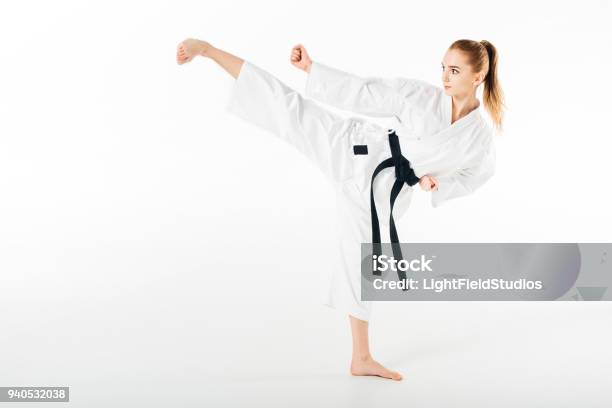 Female Karate Fighter Training Kick Isolated On White Stock Photo - Download Image Now