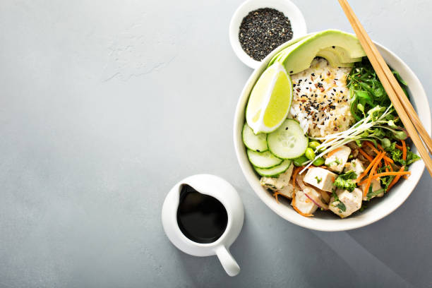 istock Poke bowl with silken tofu, rice and vegetables 940535636