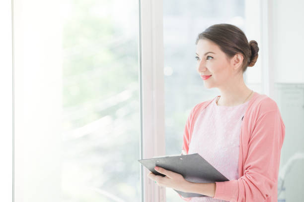 istock Business woman standing working 940538962
