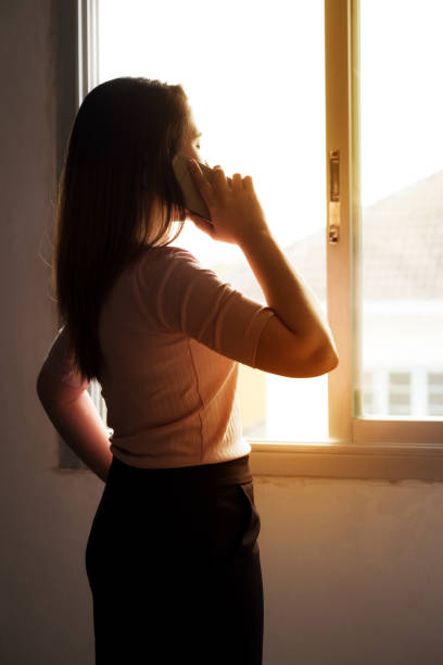istock working woman and mobile phone 940542604