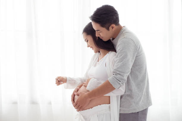 pregnant woman and her husband stock photo