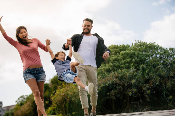 istock Couple with child on a day out 940548284