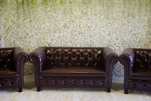 istock Classic brown sofa in wedding with petal flower background 940549144