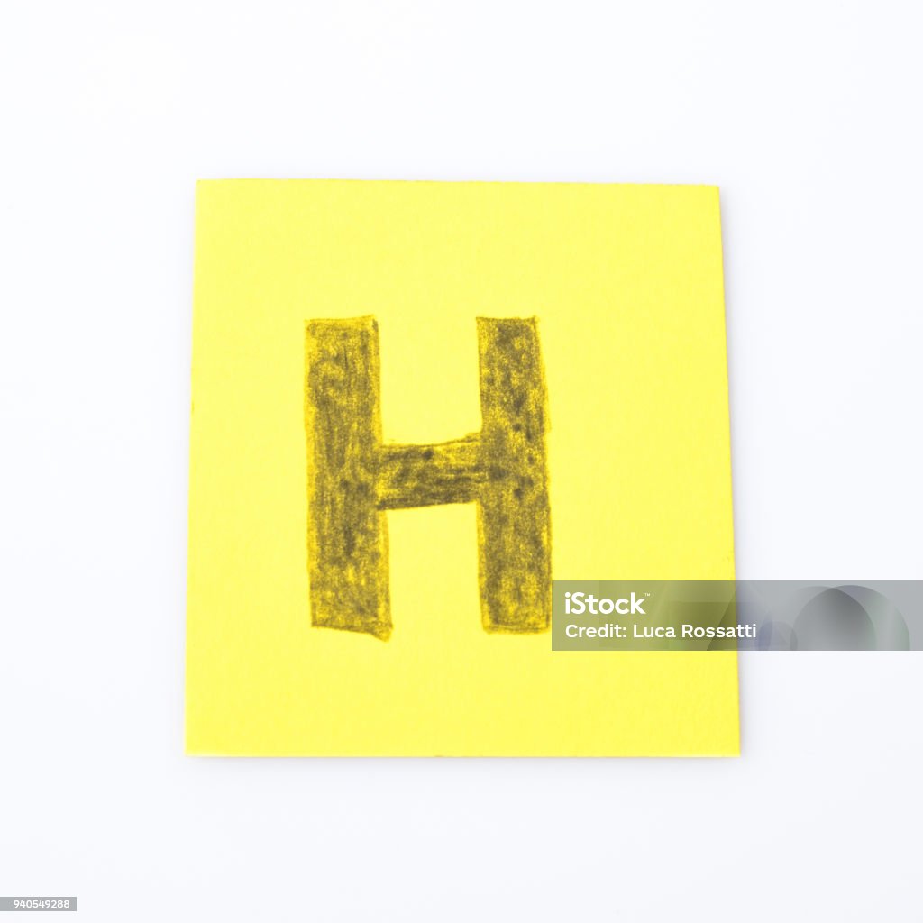 H alphabet letter handwrite on a yellow paper composition Alphabet Stock Photo