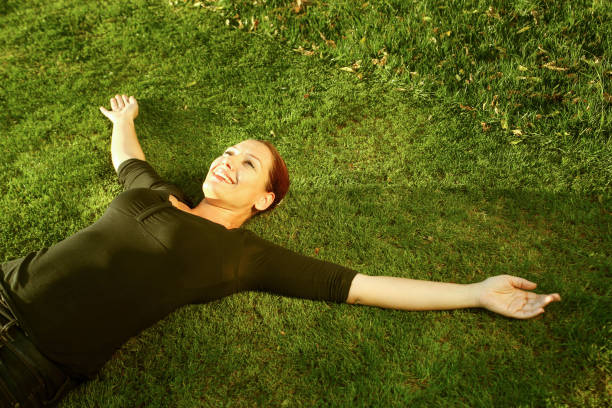 istock Beautful woman on the grass 940552440