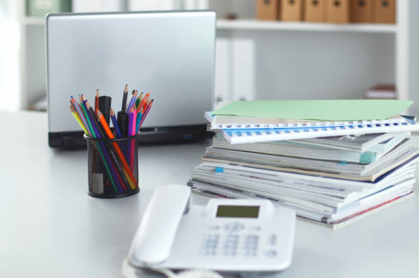 istock Workplace with notebook laptop Comfortable work table in office windows and city view 940555506
