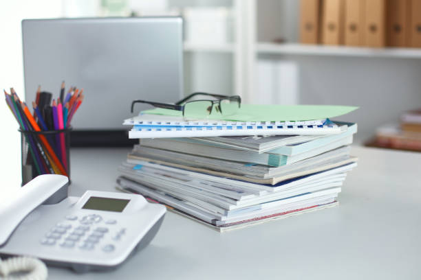 istock Workplace with notebook laptop Comfortable work table in office windows and city view 940555612